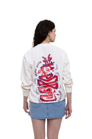 Female Wearing TURQTANG Divine Dragon Oversized Sweatshirt in Pastel Cream – dragon artwork sweatshirt back view.