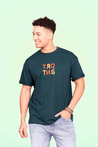 Dragonfly Oversized Tee-Shirt unisex T-shirt in teal green color worn by male model, front view