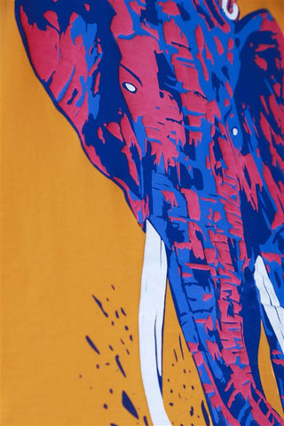 Close-up of the Elephantastic graphic print on unisex golden honey oversized T-shirt