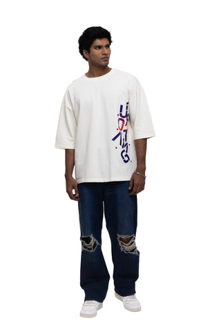 TURQTANG Stacked in Style Oversized T-Shirt in Stone Ivory – Minimalist streetwear with timeless appeal.