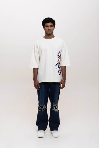 TURQTANG Stacked in Style Oversized T-Shirt in Stone Ivory – Minimalist streetwear with timeless appeal.