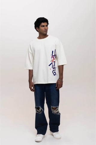 TURQTANG Stacked in Style Oversized T-Shirt in Stone Ivory – Minimalist streetwear with timeless appeal.